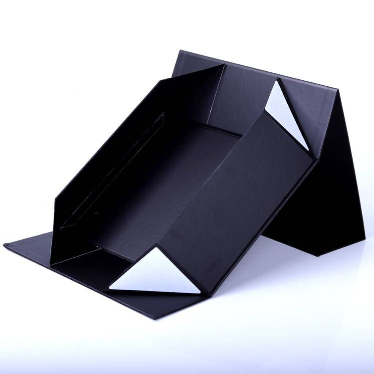 Black collapsible magnetic skincare box partially folded open
