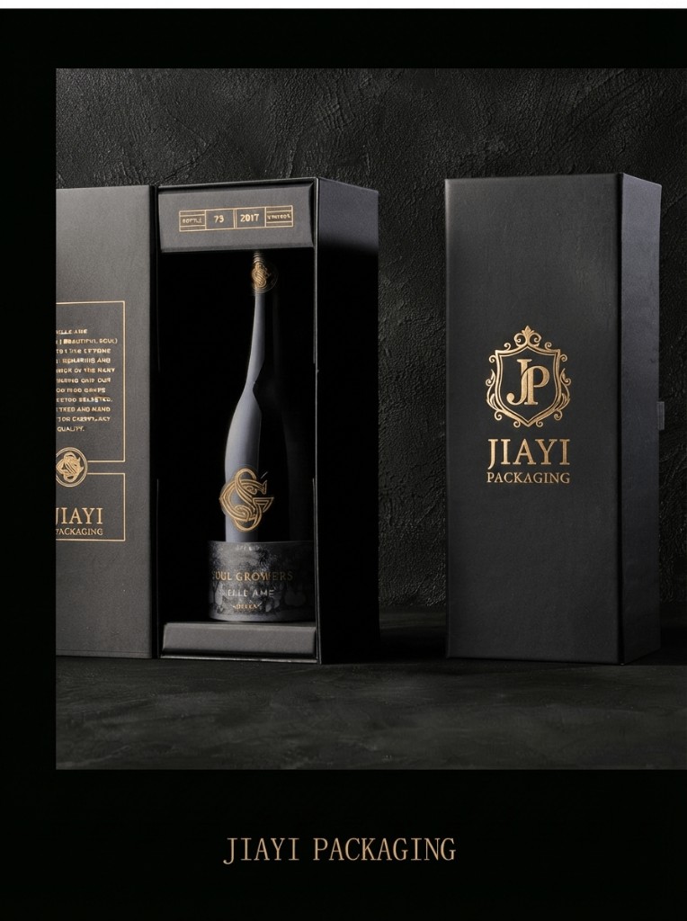 Custom black rigid wine packaging box open beside a closed gold-foil gift box