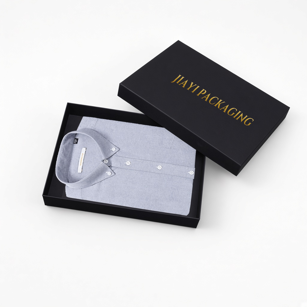Open black rigid gift box with a folded shirt — Jiayi Packaging
